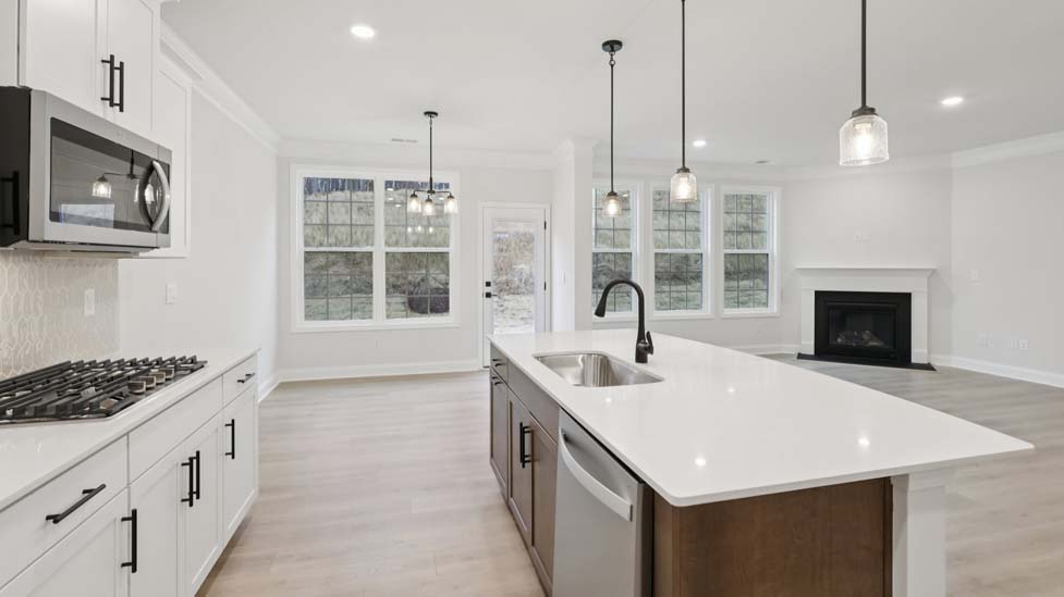 kitchen and island with stainless steel appliances
