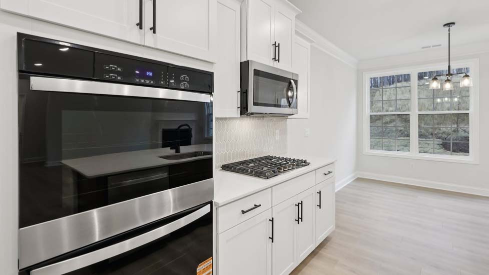 kitchen and island with stainless steel appliances