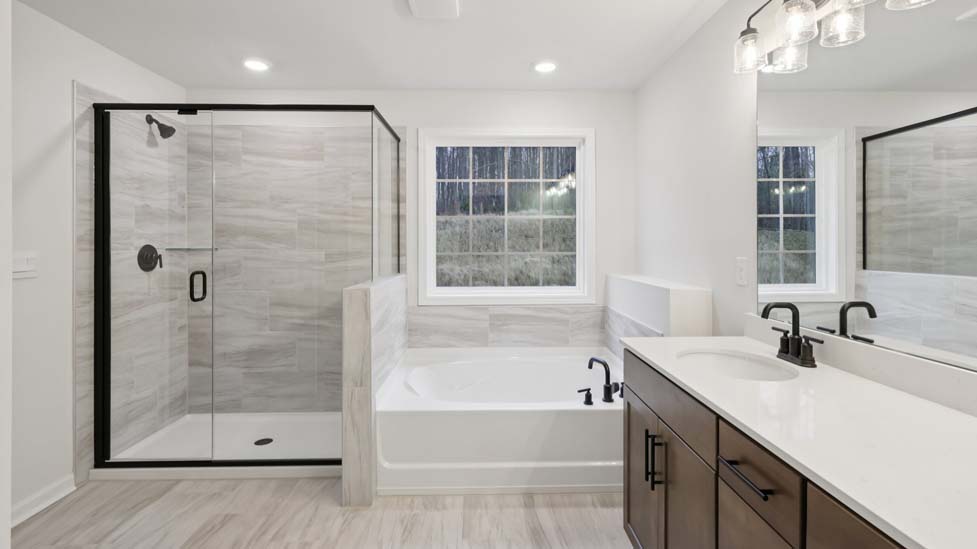 Primary bathroom with large shower and bathtub