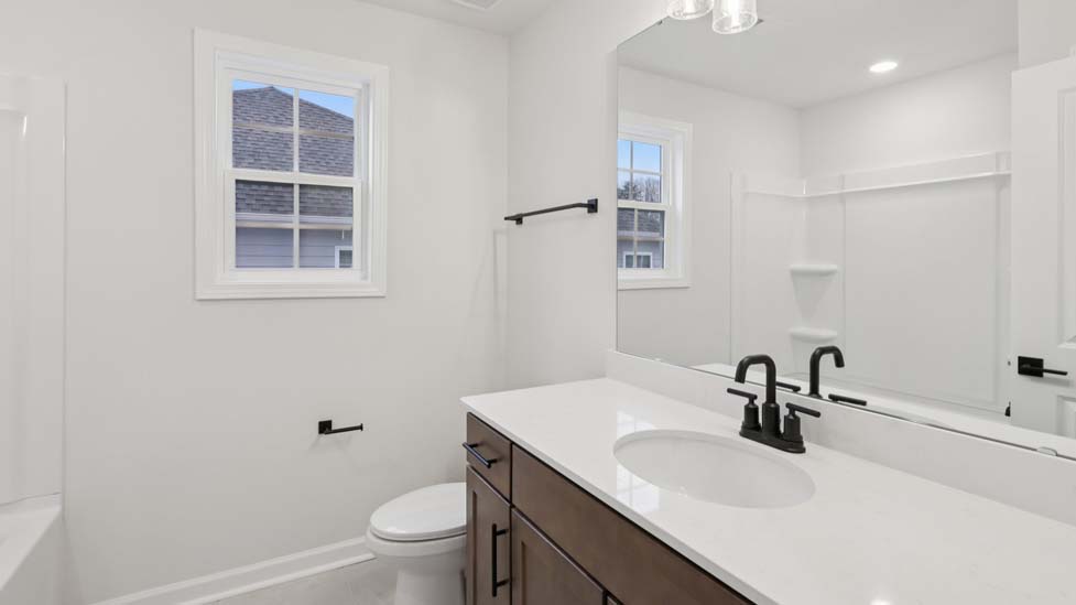 bathroom with bathtub shower combination