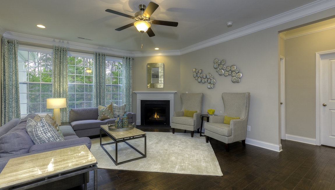 Family room with wood floors and fireplace