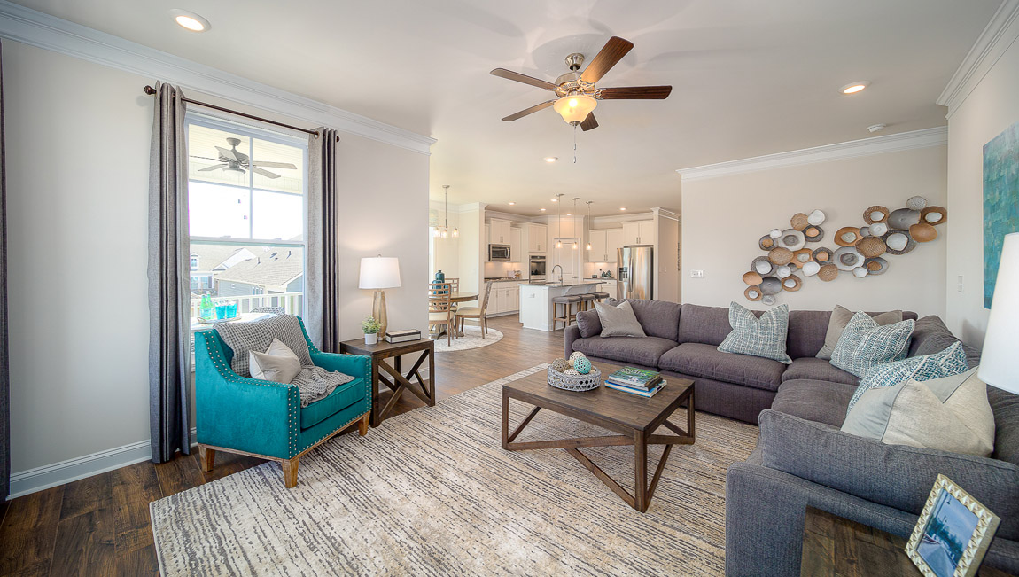 Open family room with two large window and fireplace
