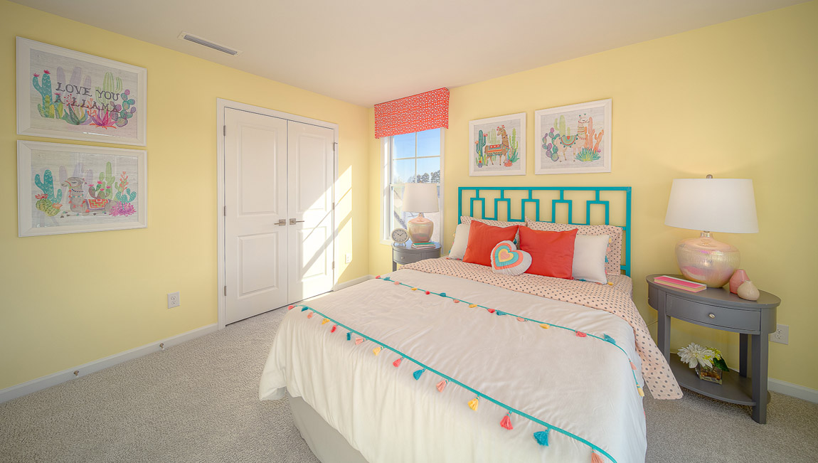 Carpeted bedroom with large windows