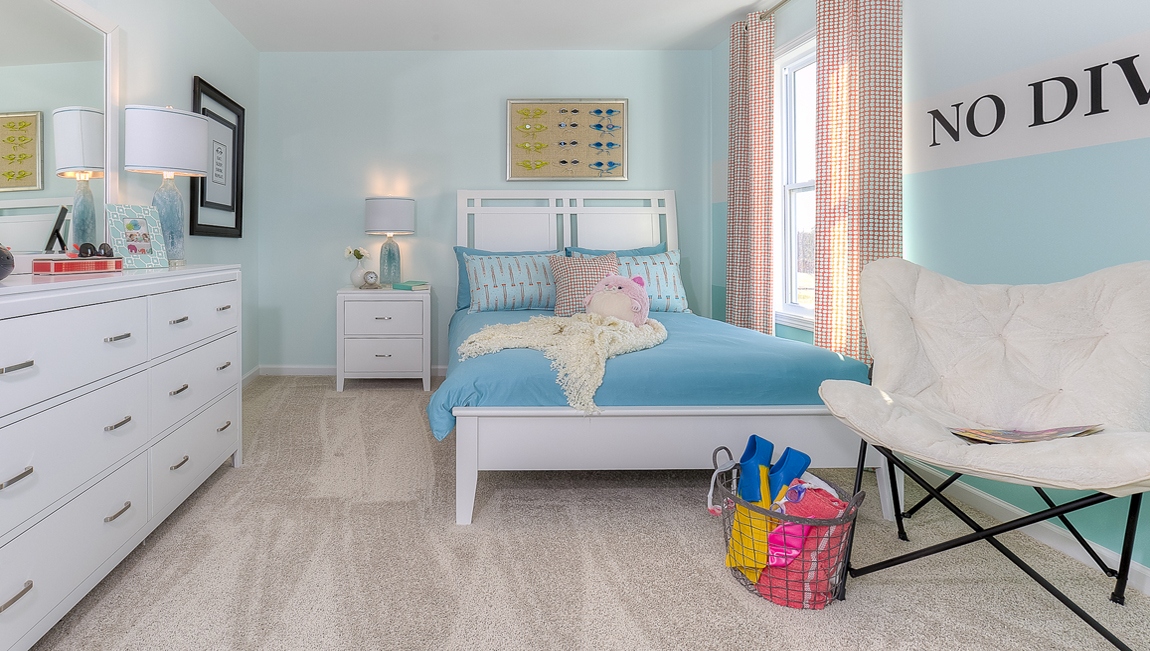 Carpeted bedroom with small window