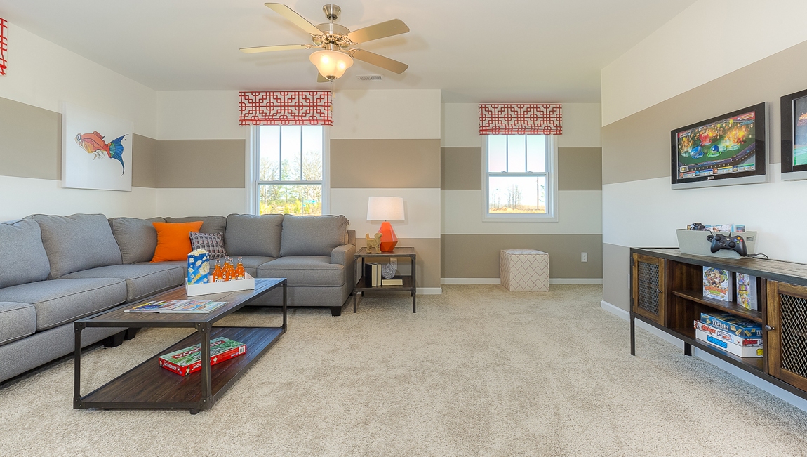 Upstairs Recreational room with carpet and two small windows