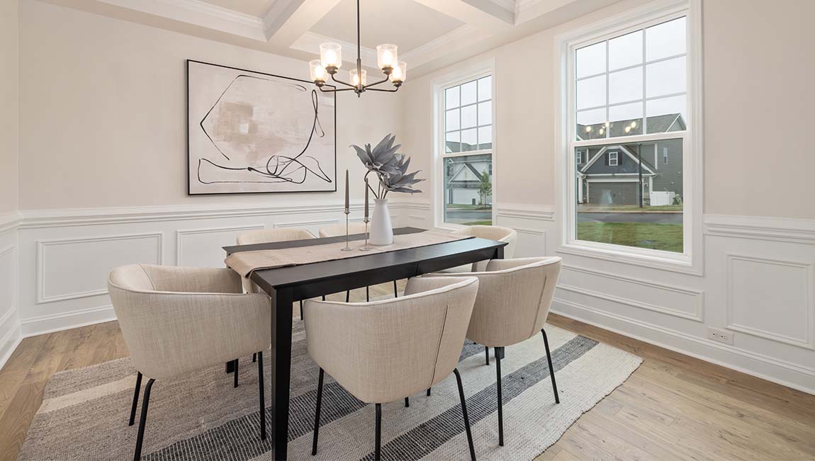 dining room with entrance way into kitchen