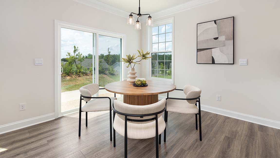 breakfast area beside kitchen and living room with sliding glass back door