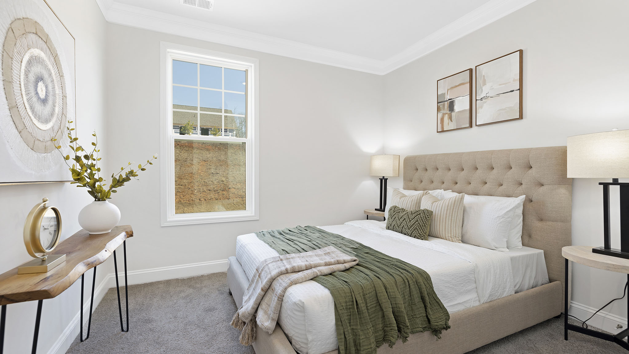 Carpeted bedroom with small window