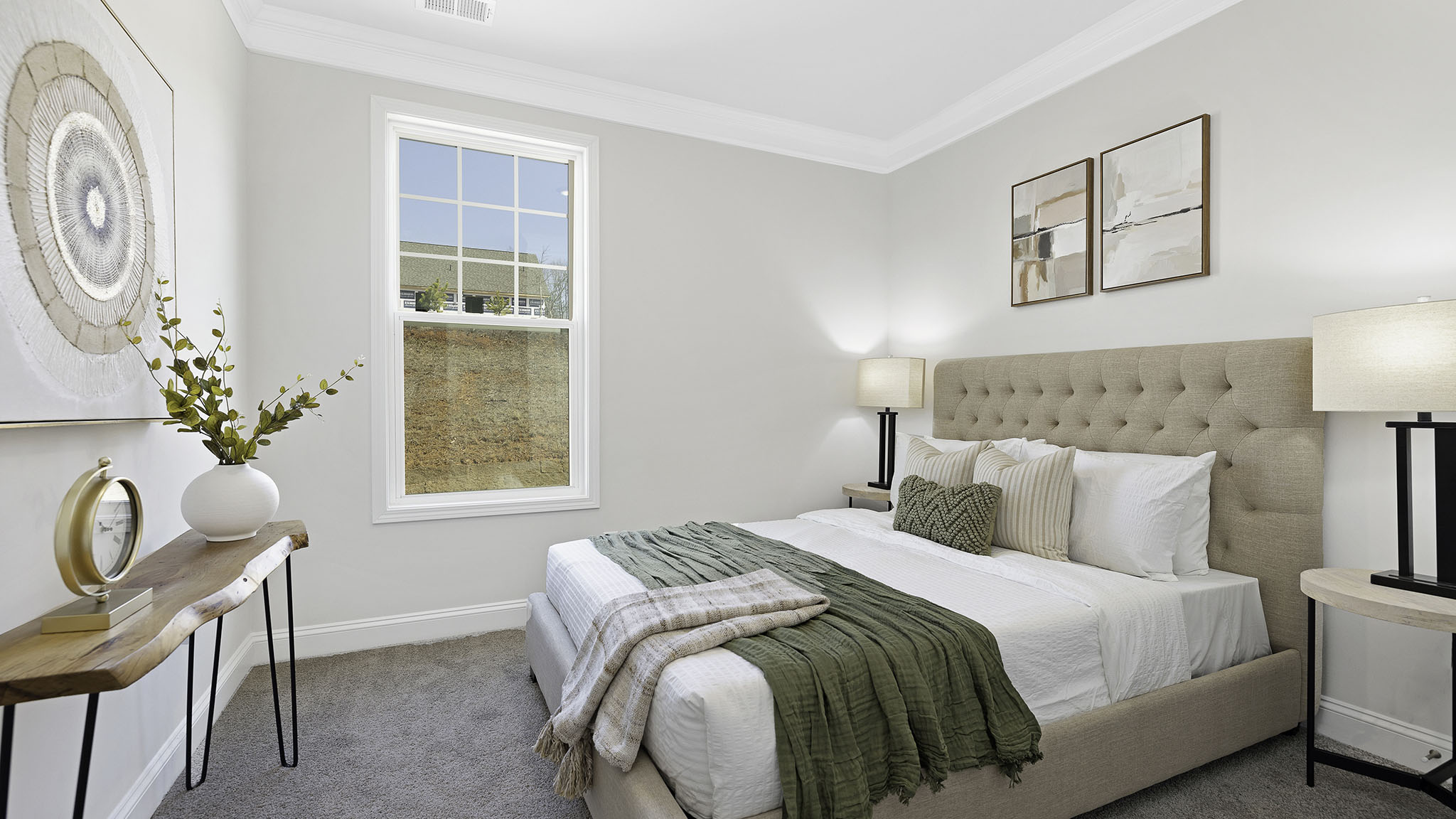 Carpeted bedroom with small window