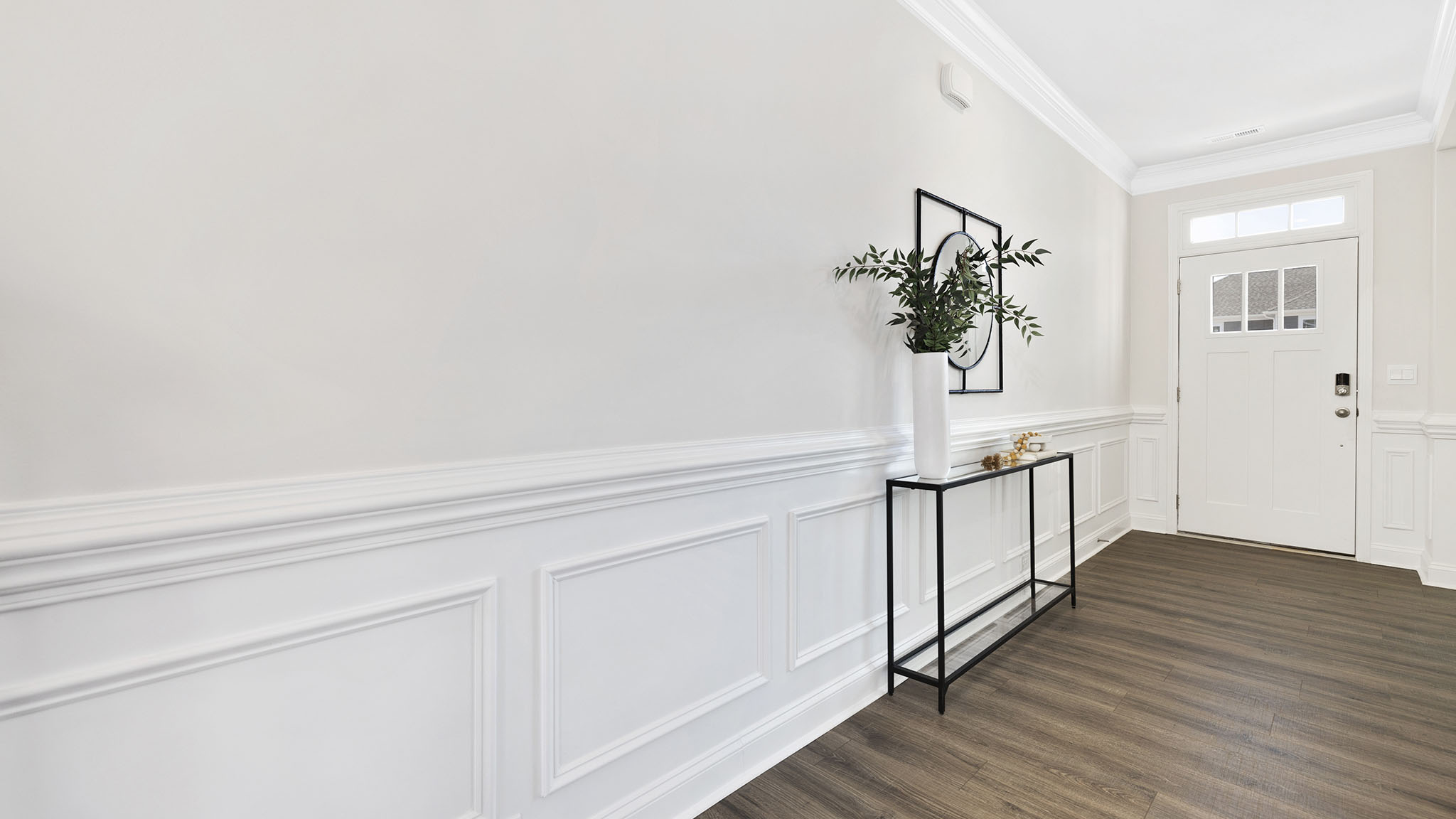 welcoming foyer with view of dining room