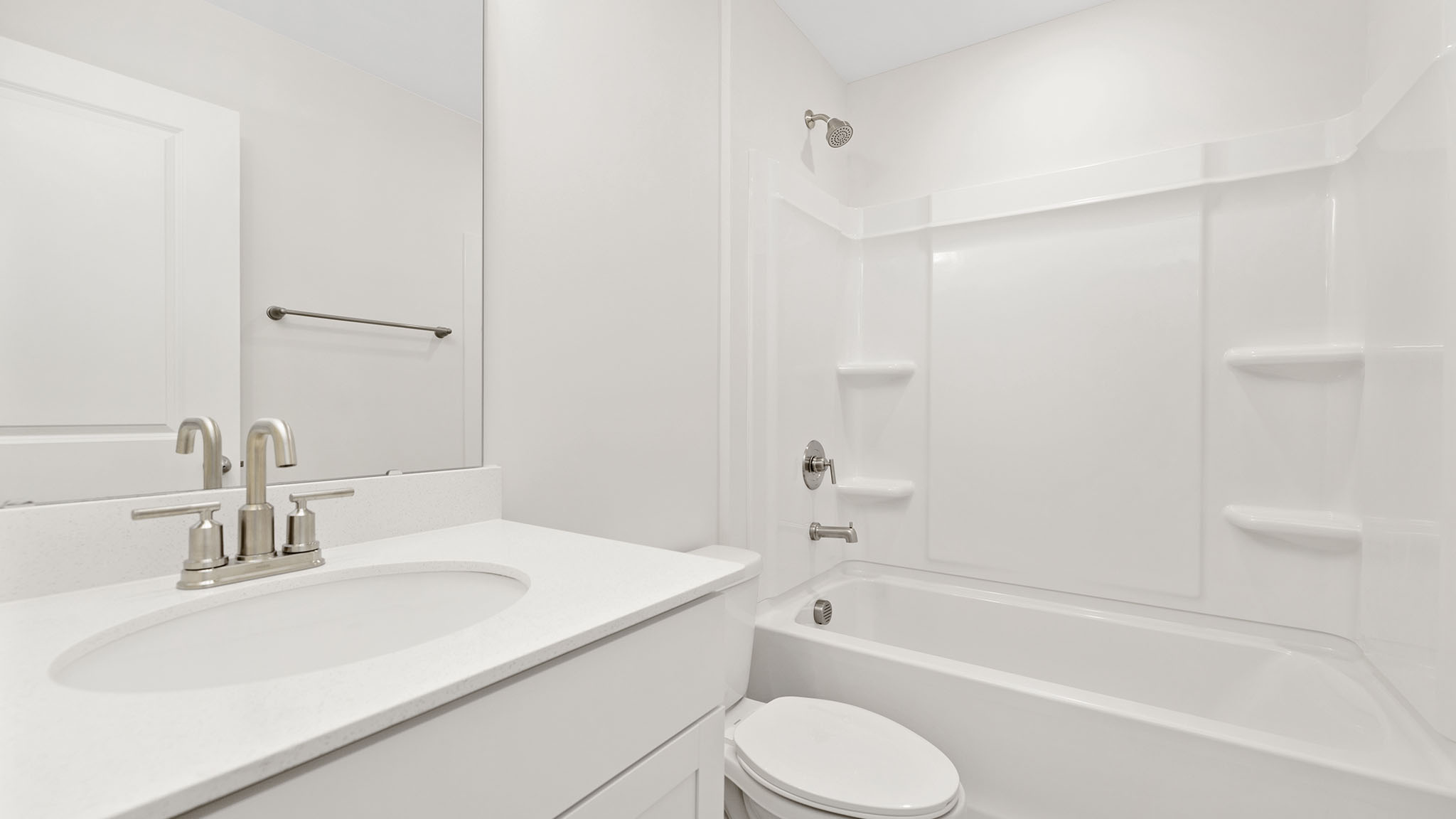 Bathroom with double sink vanity and bathtub shower combination