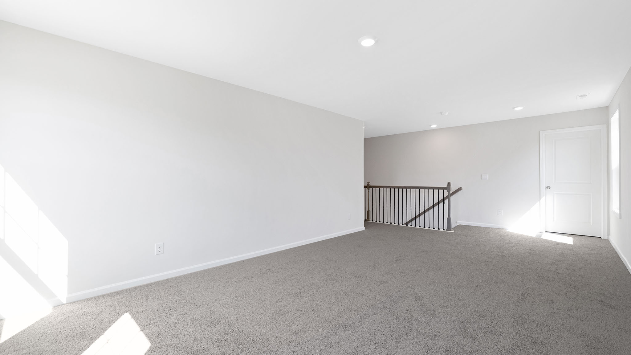 Carpeted bedroom with small window