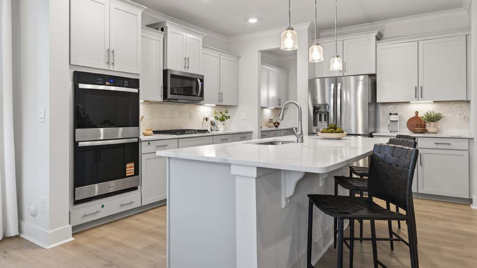 Kitchen and island with stainless steel appliances