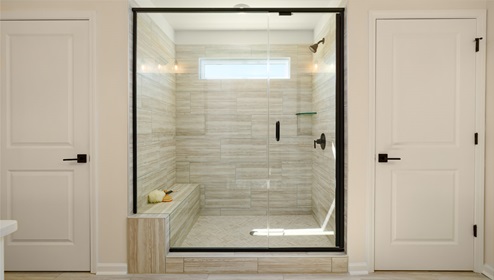 Primary bathroom with standing glass door shower