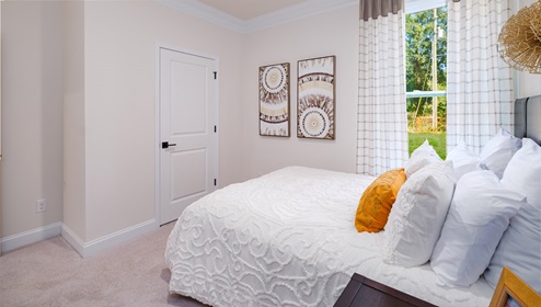 Carpeted bedroom with medium window