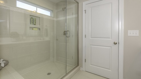 Primary bathroom with large glass standing shower