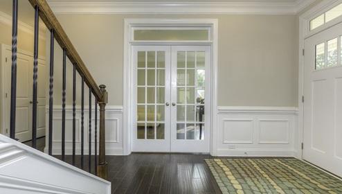 Welcoming foyer view of french doors