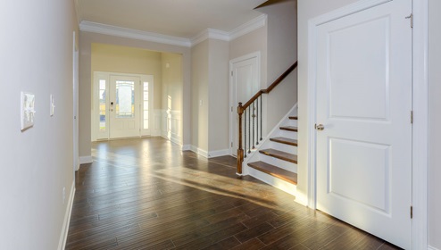 Welcoming foyer with view of hallway and staircase