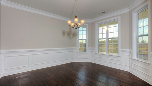 Dining room beside foyer, with three large windows