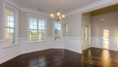 Dining room beside foyer, with three large windows