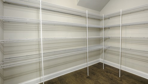 Kitchen pantry with lots of racks for storage