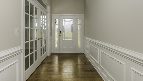 Welcoming foyer with view of front door, and  flex room with french doors