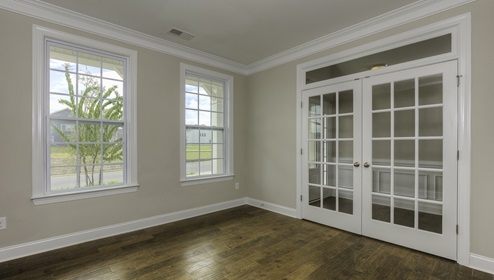 Flex room with french doors, and two large windows
