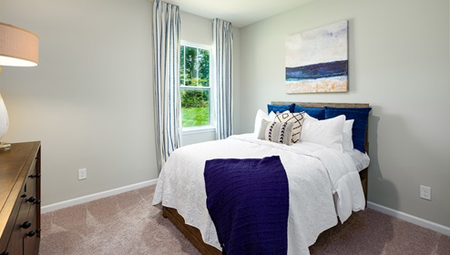 Azalea Ridge Model carpeted bedroom with small window