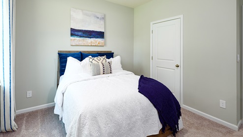 Azalea Ridge Model carpeted bedroom with small window
