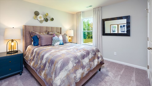 Azalea Ridge Model carpeted bedroom with window