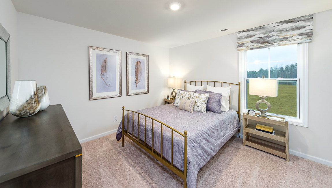 Carpeted bedroom with large window