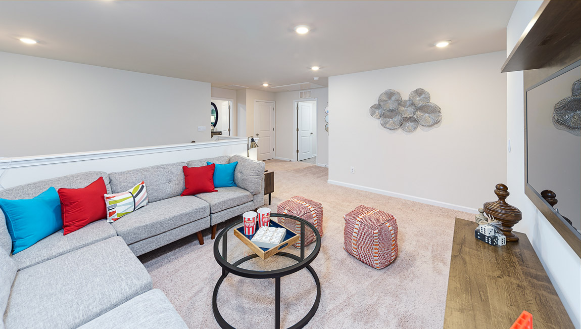 Upstairs living room space, carpeted