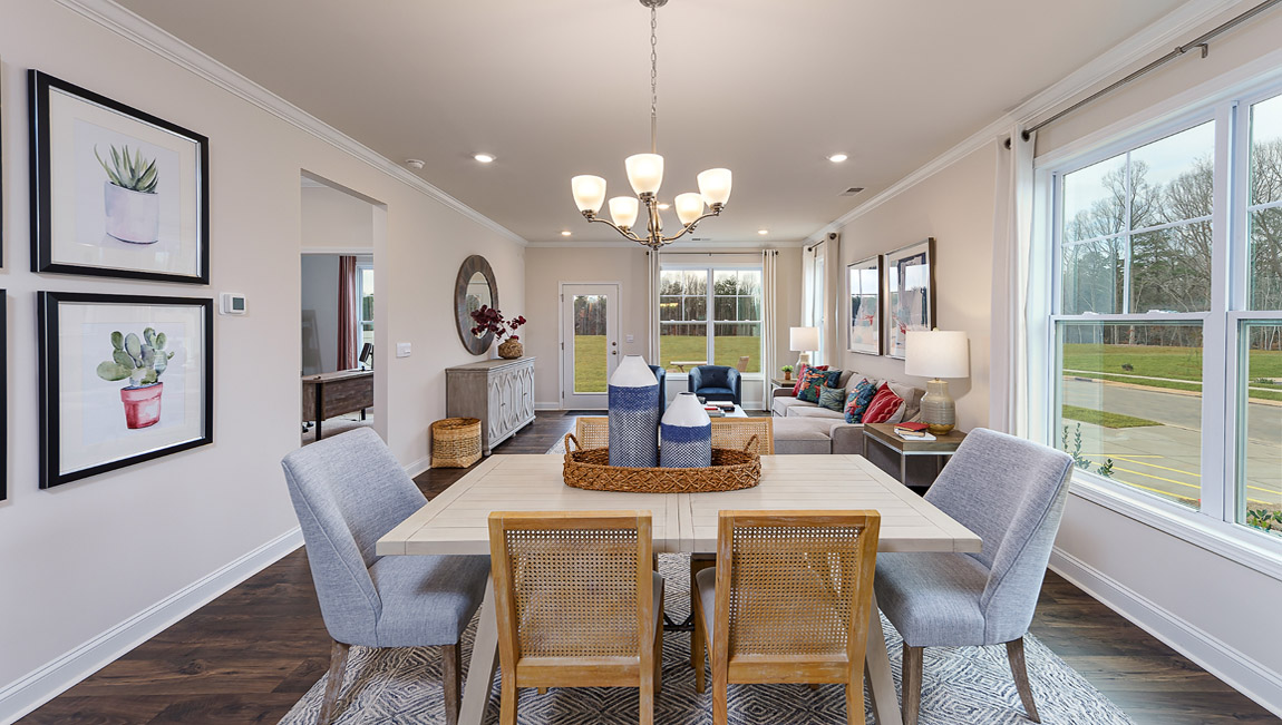 Dining area with wood floors and large window