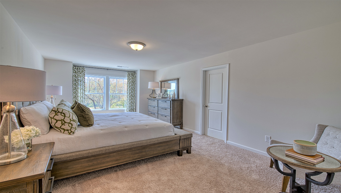 Carpeted primary bedroom