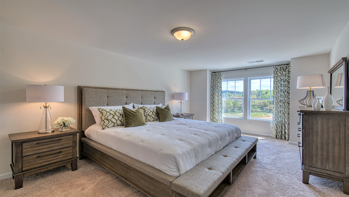 Carpeted primary bedroom