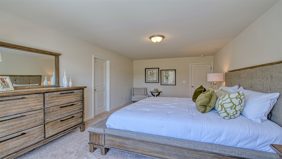 Carpeted primary bedroom