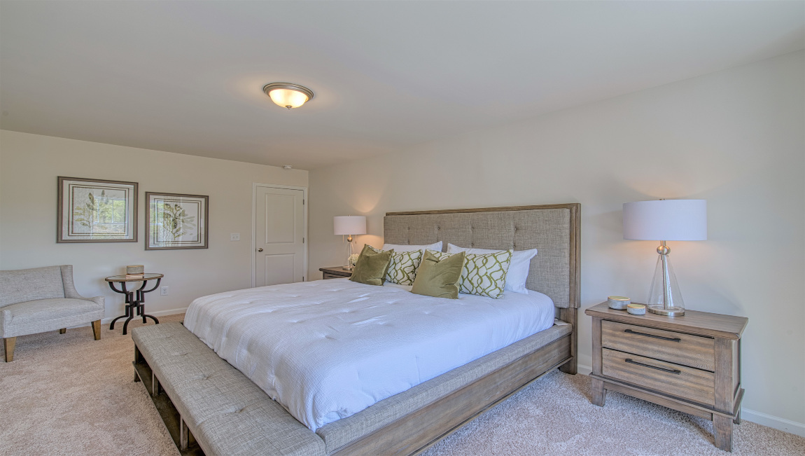 Carpeted primary bedroom