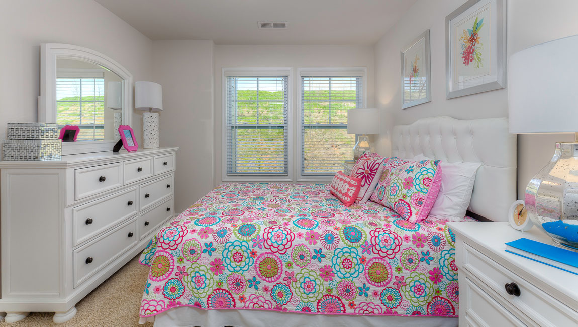 Carpeted bedroom with large window