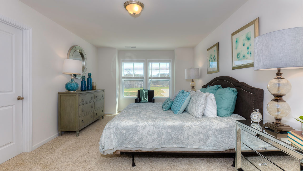 Carpeted primary bedroom
