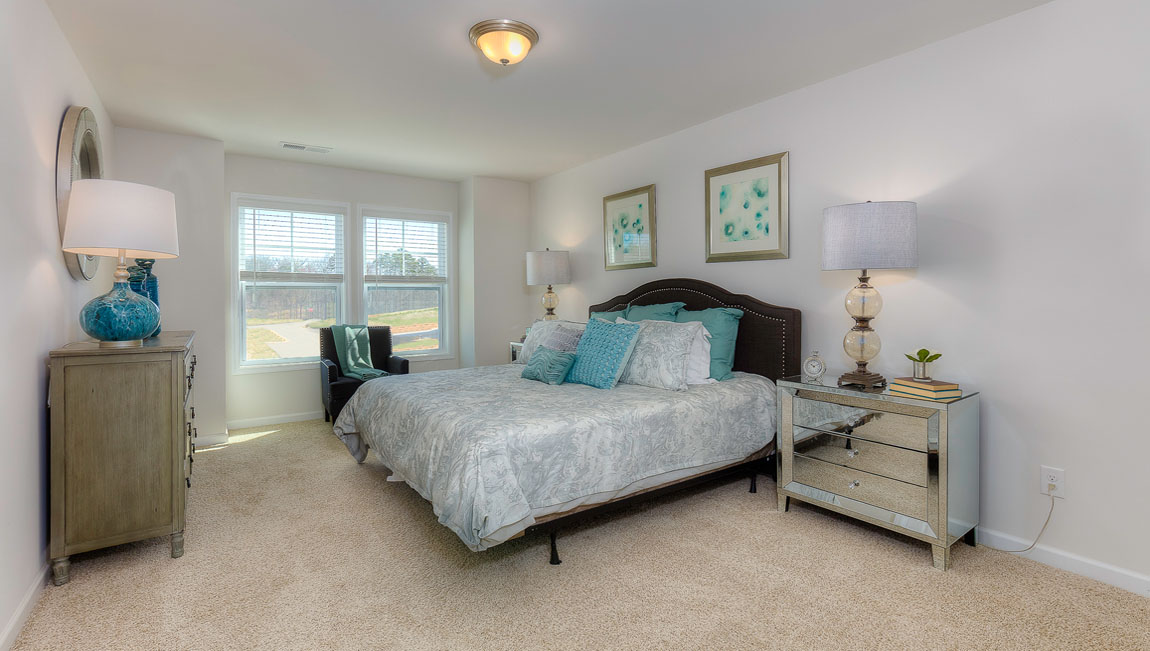 Carpeted primary bedroom