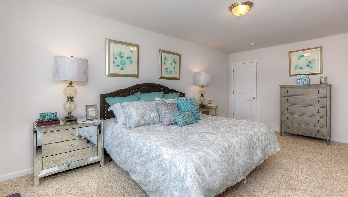 Carpeted primary bedroom