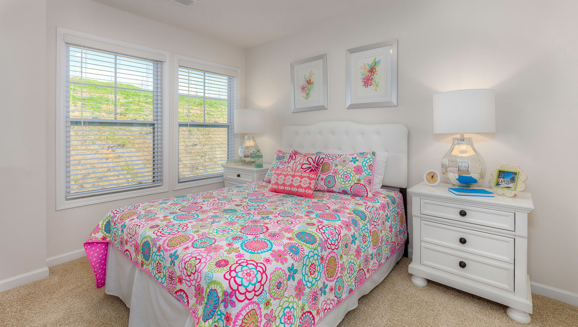 Carpeted bedroom with large window