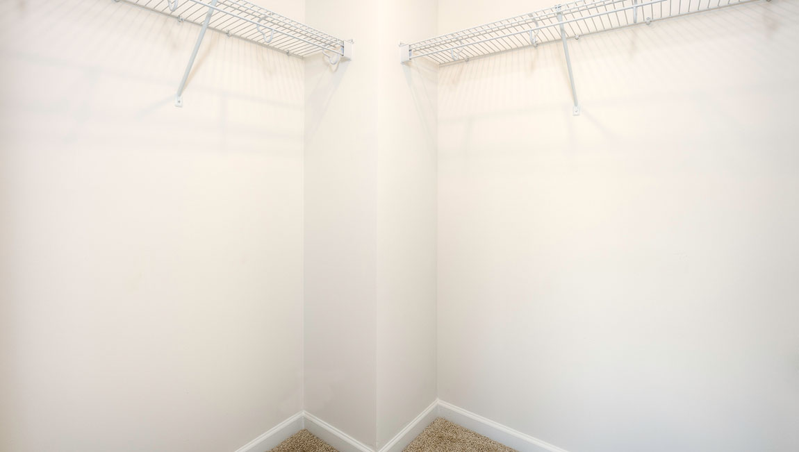 Carpeted bedroom with large window