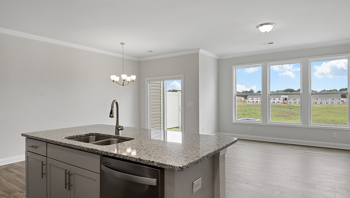 Kitchen and island with stainless steel appliances