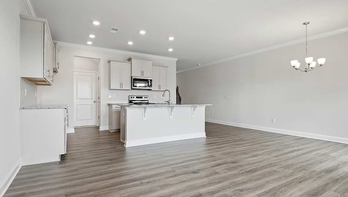 Kitchen and island with stainless steel appliances