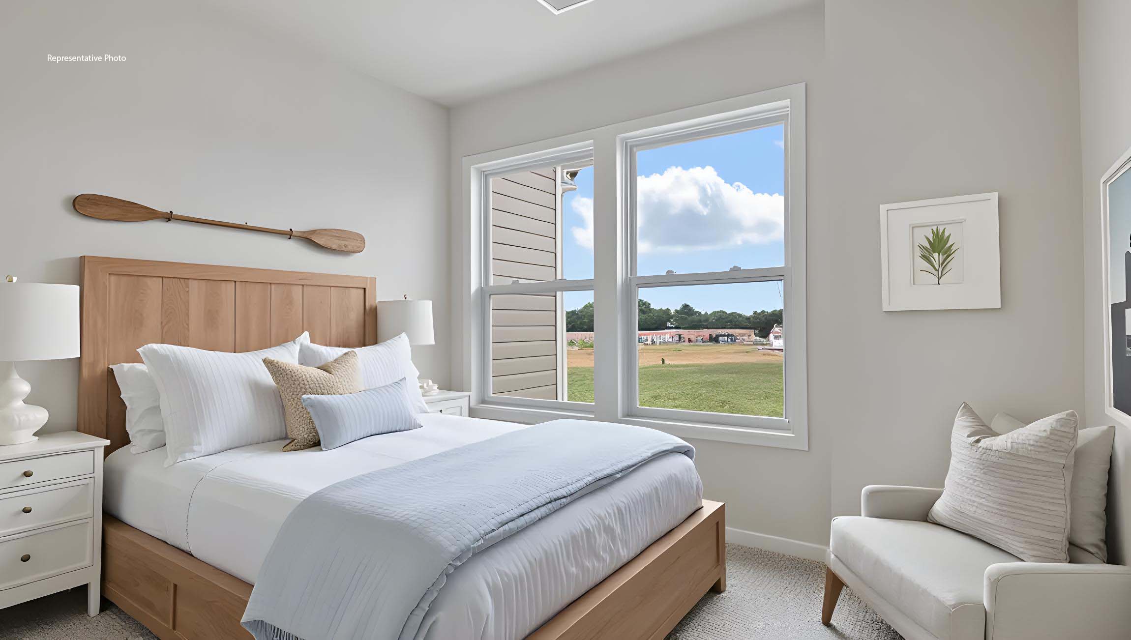 Carpeted bedroom with large window