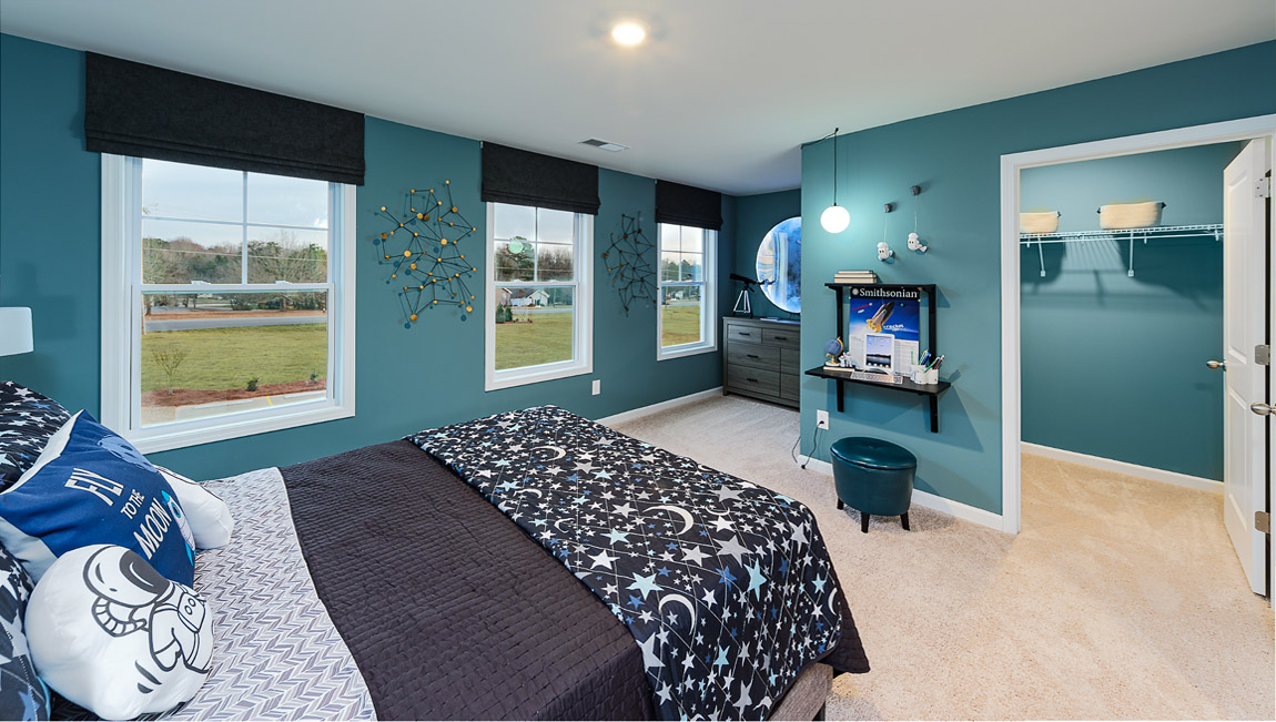 Carpeted bedroom with large window