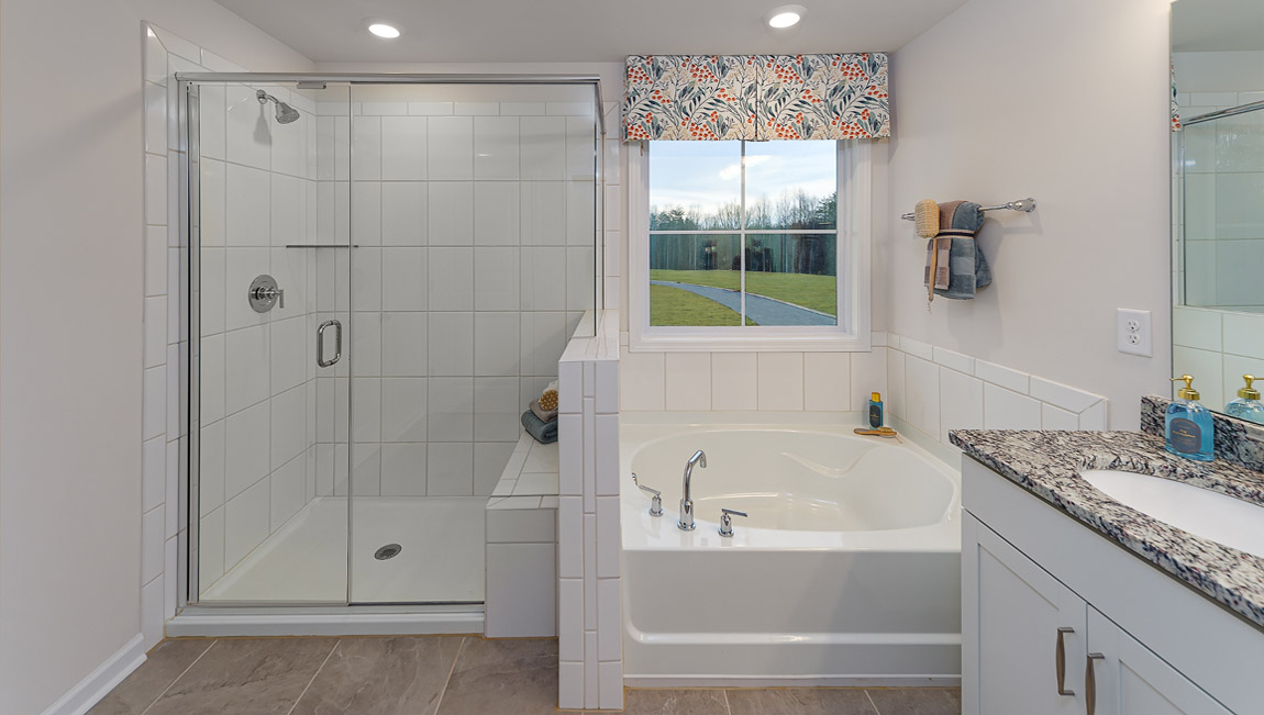Primary bathroom with soaking tub and walk in shower