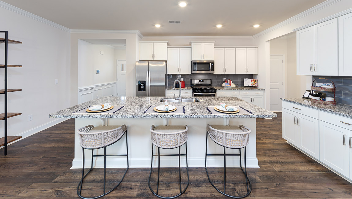 Kitchen and island with stainless steel appliances