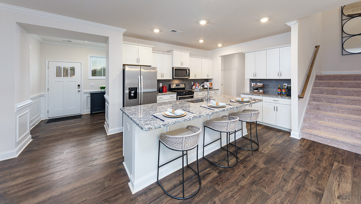 Kitchen and island with stainless steel appliances